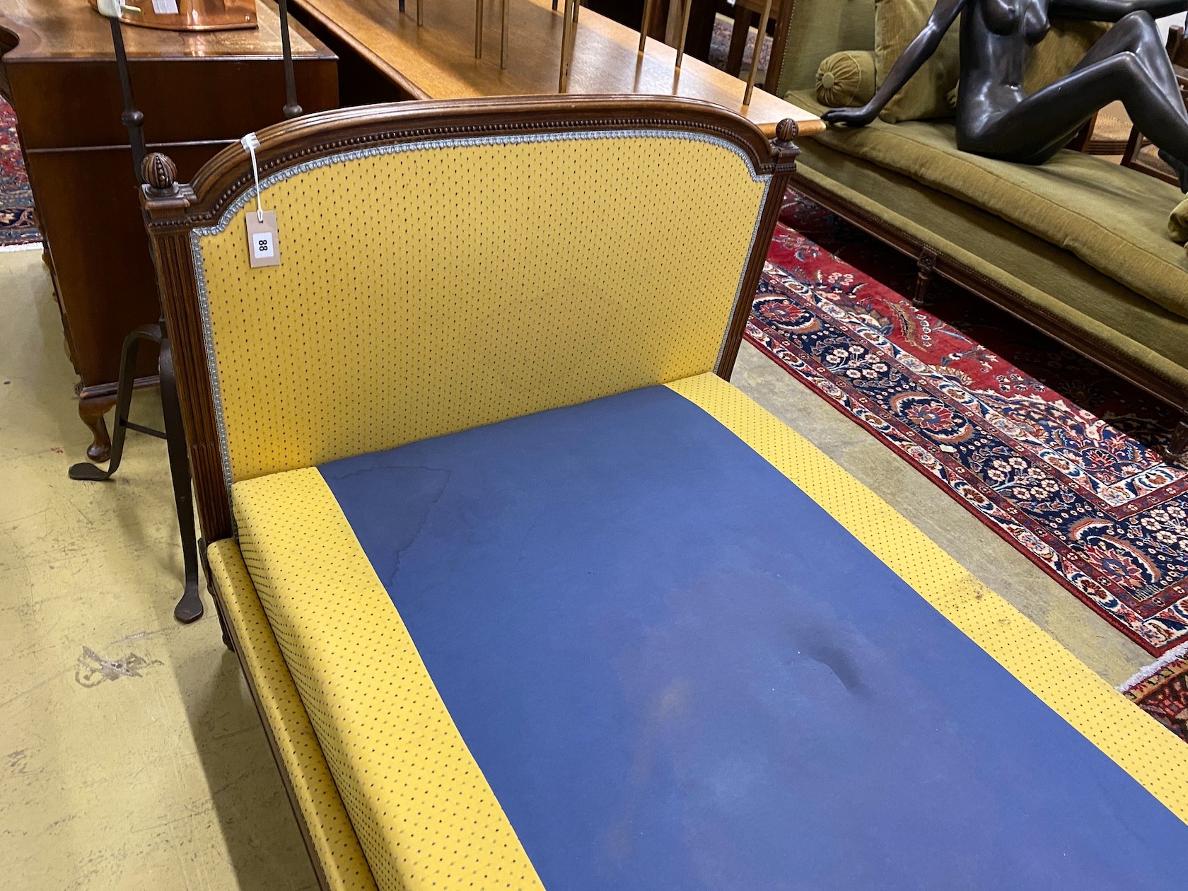 An early 20th century French mahogany day bed, length 200cm, depth 98cm, height 92cm